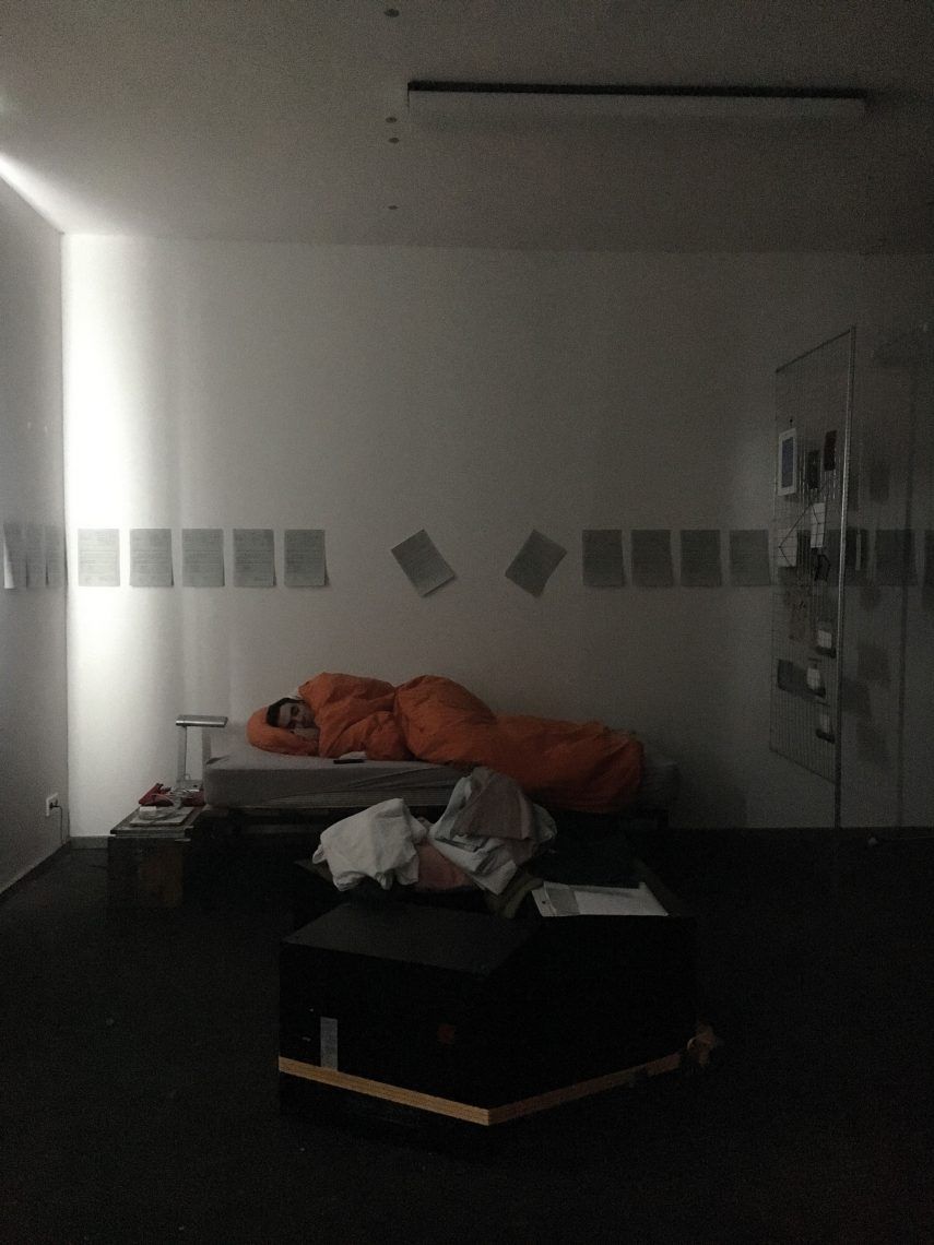 Artist sleeping in artwork